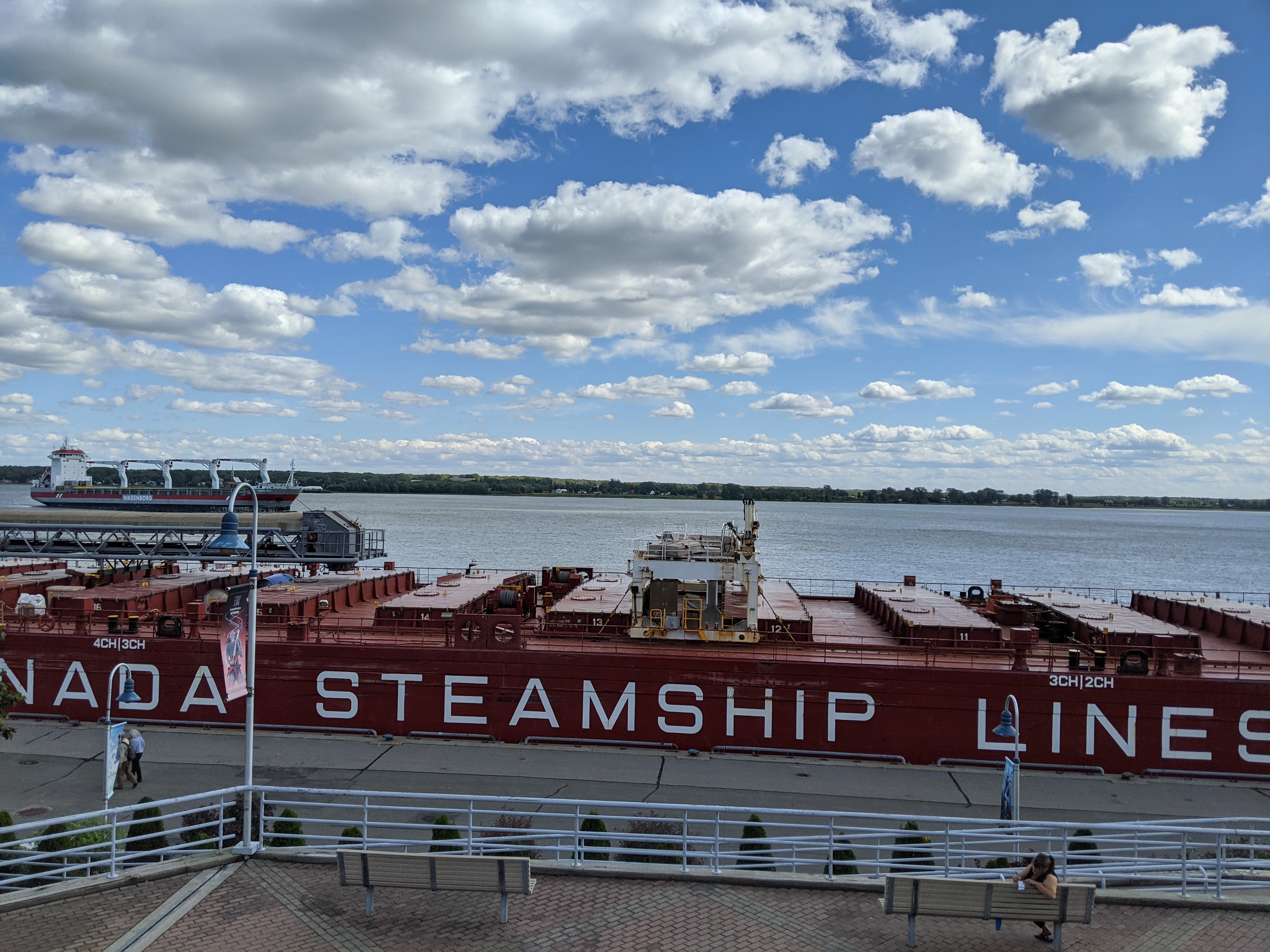 A section of a large cargo boat docked at the Trois-Rivieres peer with the name 'Canada steamship lines'