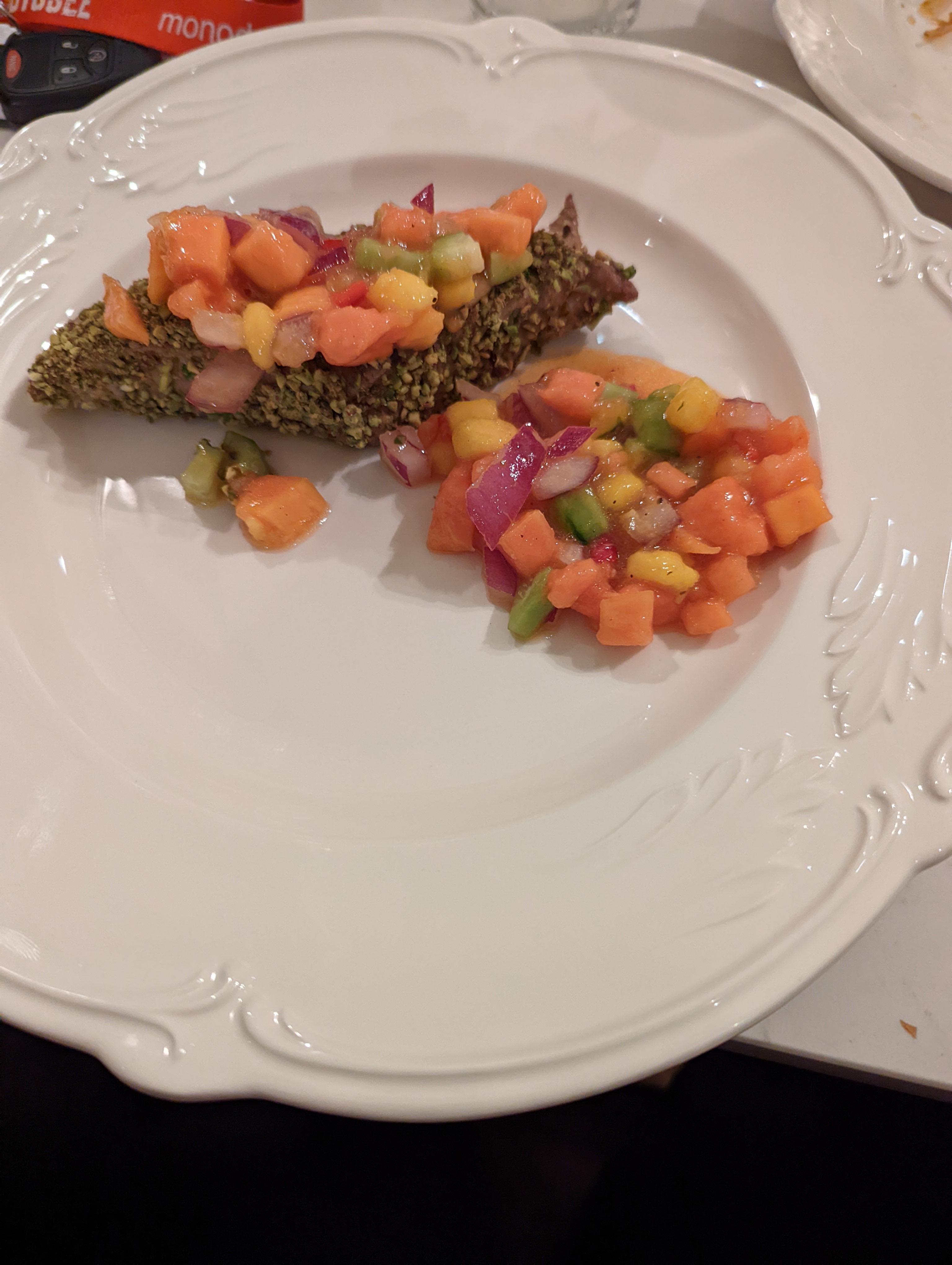 Wild Tuna covered in pistachio crumble with a tropical salsa to cover