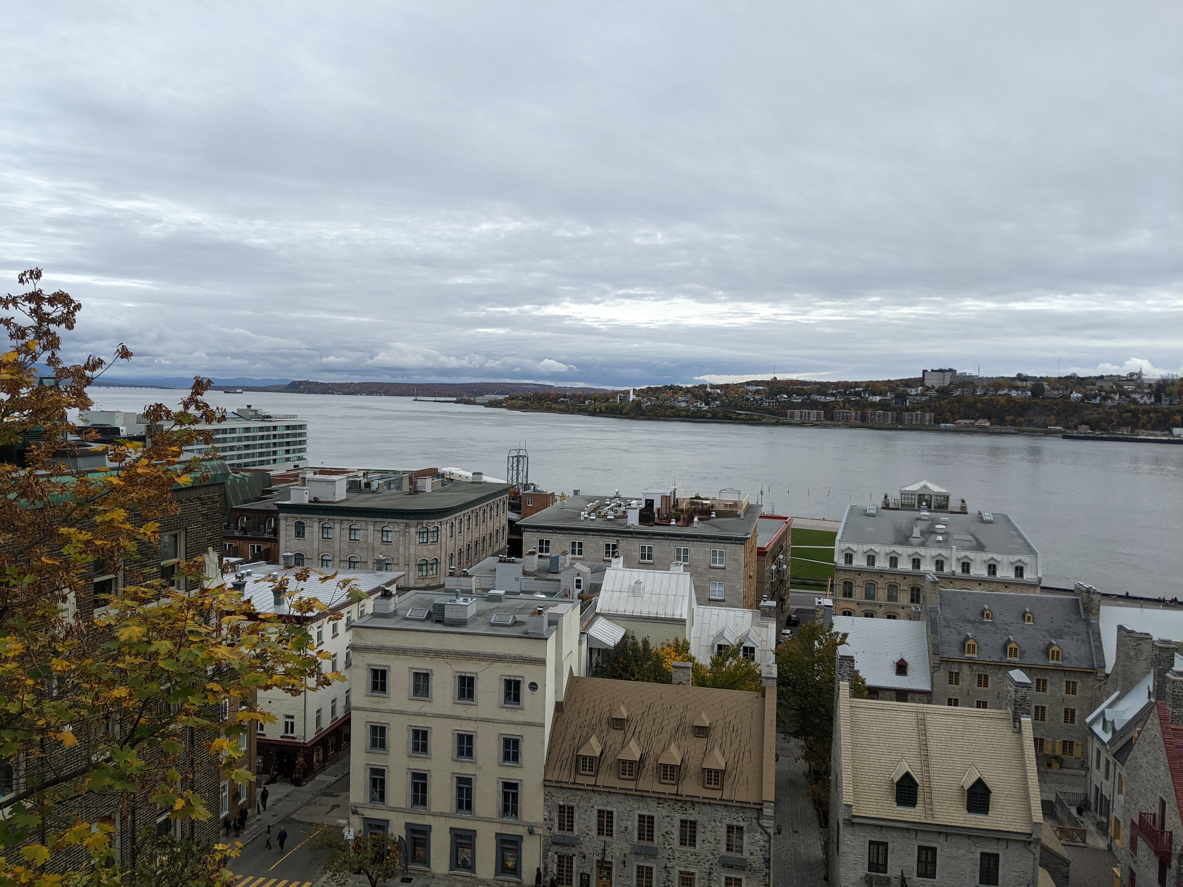 A high shot of old-Quebec and the fleuve St.Laurent with a cloudy sky in the background